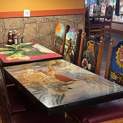 Los Amigos Mexican Restaurant - Painted chair backs and table tops have authentic artwork.