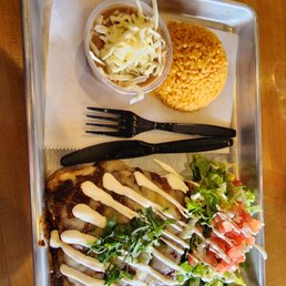 Red mole enchiladas, with rice and refried beans.