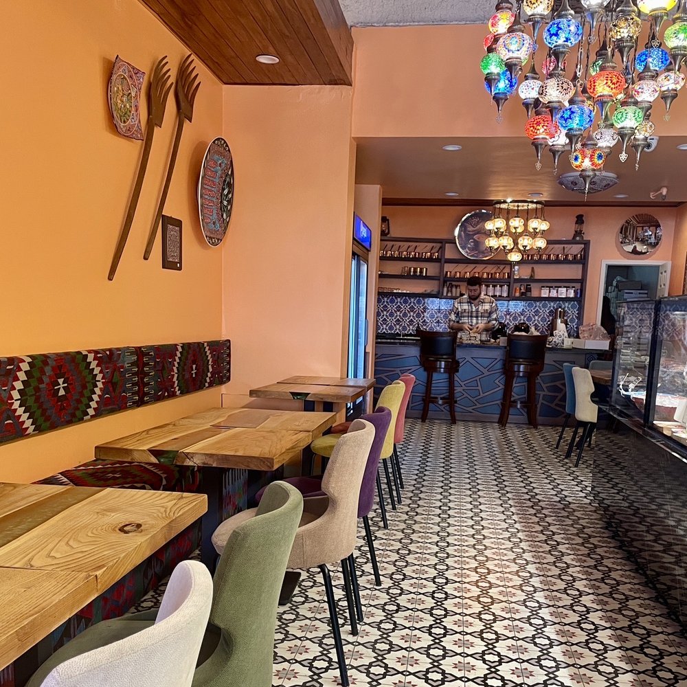 Troya - Main seating area right in front of the Turkish Delight display - Desserts Near Me - Monterey, California Troya - Main seating area right in front of the Turkish Delight display - Desserts Near Me - Monterey, California