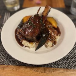 The Palisades Restaurant - Wild Boar Ossobuco, Bordelaise, Caramelized onion & Bourbon Grits, Chili & Honey Roasted Acorn Squash