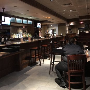 Red Lobster - a man sitting at a bar - Seafood Near Me - Rochester Hills, Michigan Red Lobster - a man sitting at a bar - Seafood Near Me - Rochester Hills, Michigan