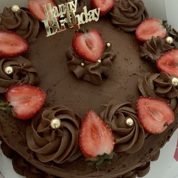 Cynthia's Crumbly Creations - Custom White Cake with Chocolate Buttercream Frosting, Fresh Strawberries & Gold details - Desserts Near Me