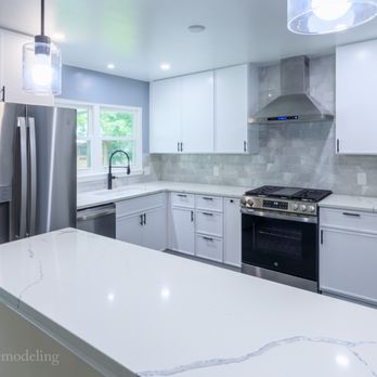 Zion Home Remodeling - This picture shows the full kitchen after a complete remodel in Clinton, Maryland, featuring a bar-height cut wall with a new... - General Contractors Near Me - Upper Marlboro, Maryland Zion Home Remodeling - This picture shows the full kitchen after a complete remodel in Clinton, Maryland, featuring a bar-height cut wall with a new... - General Contractors Near Me - Upper Marlboro, Maryland