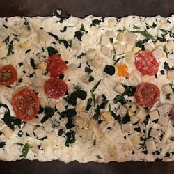 Walmart Supercenter - Marketside Artichoke Spinach Tomato Flatbread Pizza. Tasty.
