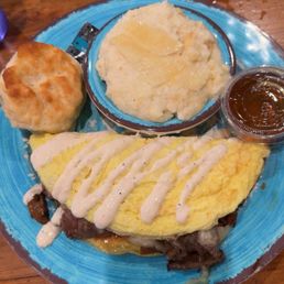Omelette steakhaus style with cheese grits and the southern biscuit Omelette steakhaus style with cheese grits and the southern biscuit