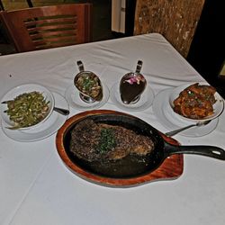 Restaurant Rebirth - Rib eye steak, fingerling potatoes, and green beans, homemade steak sauce