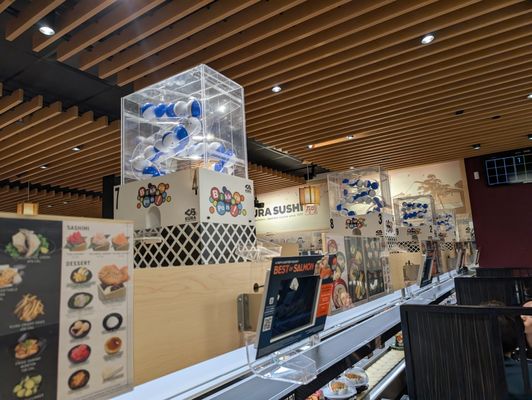 Kura Revolving Sushi Bar by null