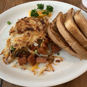 Moke’s Bread And Breakfast - Hash brown omelet with mokapu filling. Notice that the toast took up almost half of the plate. - Breakfast & Brunch Near Me - Honolulu, Hawaii