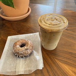 Old fashioned donut and oat milk latte Old fashioned donut and oat milk latte
