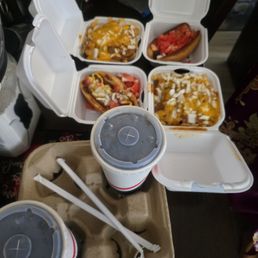 The tomatoes and toppings are covering the burnt dry hot dog. I paid 50 dollars never order here again. It wasn't even good The tomatoes and toppings are covering the burnt dry hot dog. I paid 50 dollars never order here again. It wasn't even good