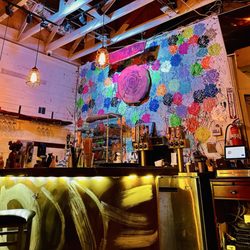 Rosewood Kitchen - Super cool art below & behind bar. the copper artist installation inside was dope too