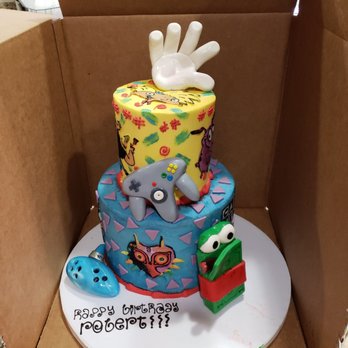 Upper Crust Bakery - A 90's nostalgia cake tailored to some of my cousin's favorite cartoons and video games. - Bakeries Near Me - Chico, California Upper Crust Bakery - A 90's nostalgia cake tailored to some of my cousin's favorite cartoons and video games. - Bakeries Near Me - Chico, California