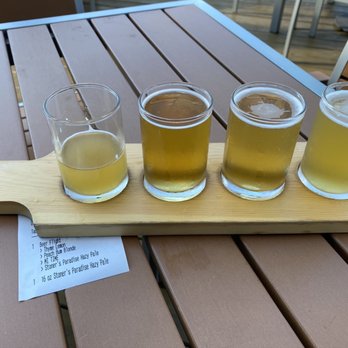 Ghost Isle Brewery - Beer Flight: Thyme Lemon, Peach Bum Blonde, MI TIME, Stoner's Paradise Hazy Pale Ale - Brewpubs Near Me - New Buffalo, Michigan Ghost Isle Brewery - Beer Flight: Thyme Lemon, Peach Bum Blonde, MI TIME, Stoner's Paradise Hazy Pale Ale - Brewpubs Near Me - New Buffalo, Michigan