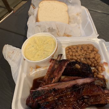 Triple J's Smokehouse - Ribs dinner with baked beans and potato salad. The even give you some bread to sop your plate. Don't skip the sauce! - Barbeque Near Me - Houston, Texas Triple J's Smokehouse - Ribs dinner with baked beans and potato salad. The even give you some bread to sop your plate. Don't skip the sauce! - Barbeque Near Me - Houston, Texas