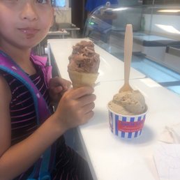 Chocolate peanut butter in a regular cone and cappuccino chunk in a cup Chocolate peanut butter in a regular cone and cappuccino chunk in a cup