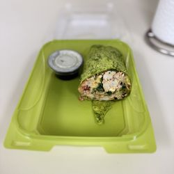 Salata - Wrap pesto chicken, shrimp, spinach, strawberries, pineapples & chipotle dressing.  Ranch dressing on the side to eat with my pita chips.