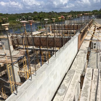 Synergy Construction SW Florida - a construction site with concrete walls and scaffolding - General Contractors Near Me Synergy Construction SW Florida - a construction site with concrete walls and scaffolding - General Contractors Near Me