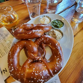 Bell Tower Brewing - Bavarian-style pretzels with Bell Tower mustard, warm local goat cheese dip, and muddled her kombucha dip - Brewpubs Near Me - Kent, Ohio Bell Tower Brewing - Bavarian-style pretzels with Bell Tower mustard, warm local goat cheese dip, and muddled her kombucha dip - Brewpubs Near Me - Kent, Ohio