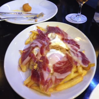 El Pequeño Barco - Huevos rotos con ibérico. - Mediterranean Near Me - Madrid, M El Pequeño Barco - Huevos rotos con ibérico. - Mediterranean Near Me - Madrid, M