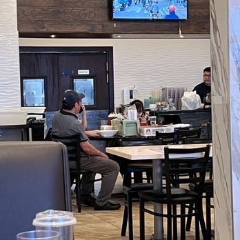 Pho 99 - Staff, including our waitress, having a lunch break while we are waiting for the check. - Vietnamese Near Me - Eatontown, New Jersey Pho 99 - Staff, including our waitress, having a lunch break while we are waiting for the check. - Vietnamese Near Me - Eatontown, New Jersey
