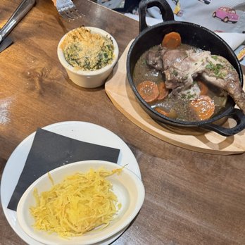 Chez Henry's - Coq au vin with two sides, piece of chicken with some carrots in it - New American Near Me - Delray Beach, Florida Chez Henry's - Coq au vin with two sides, piece of chicken with some carrots in it - New American Near Me - Delray Beach, Florida
