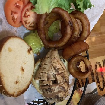 The Goat Saloon - Grilled chicken sandwich and a side of onion rings - Bars Near Me - Taylors Falls, Minnesota The Goat Saloon - Grilled chicken sandwich and a side of onion rings - Bars Near Me - Taylors Falls, Minnesota