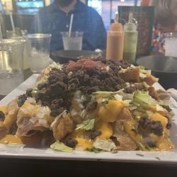 Freddie's Off The Chain Mexican Cuisine - Steak nachos with salsa I added