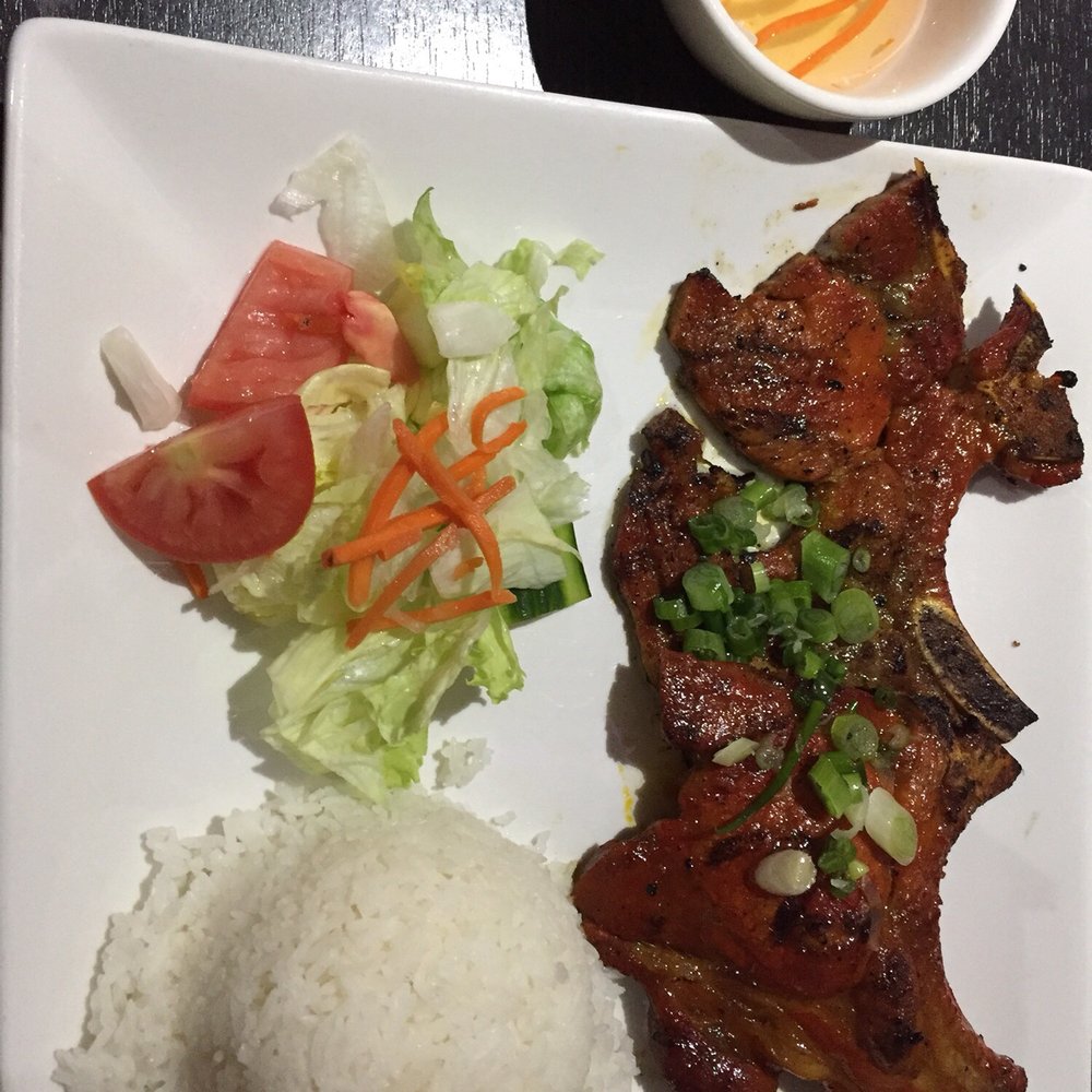 Pho Saigon Bay - Pork Chop (bone in) with rice. Sauce on the side was great! - Vietnamese Near Me - Stockton, California Pho Saigon Bay - Pork Chop (bone in) with rice. Sauce on the side was great! - Vietnamese Near Me - Stockton, California