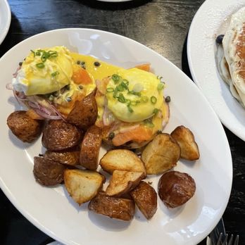 Spruce Cafe - Salmon Eggs Benedict with potatoes - Breakfast & Brunch Near Me - Seattle, Washington Spruce Cafe - Salmon Eggs Benedict with potatoes - Breakfast & Brunch Near Me - Seattle, Washington