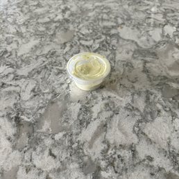 They give you no sauce and charge $1 for this tiny cup which isn't enough to last your whole meal. They give you no sauce and charge $1 for this tiny cup which isn't enough to last your whole meal.