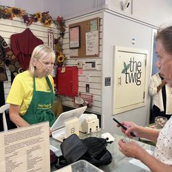The Twig Thrift Shop - A Twig volunteer taking care of a happy thrifter!