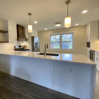 J Lee Design & Construction - a kitchen with a center island - Painters Near Me J Lee Design & Construction - a kitchen with a center island - Painters Near Me