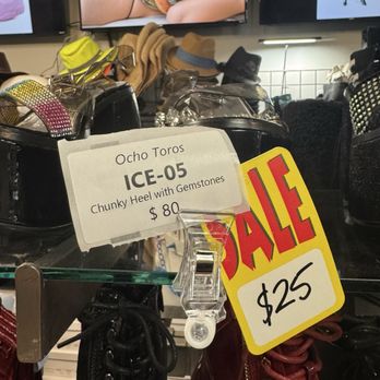 Freak House - Chunky heel shoes with gemstones are on sale at a store, priced at $25, with a sign indicating the discount. - Shoe Stores Near Me - Miami, Florida