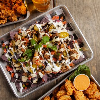 Sway x Bowlounge - two trays of food and a glass of beer - Bowling Near Me - Fort Worth, Texas