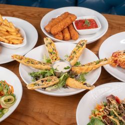 Rock & Brews - Orlando - Chicken Parm Lunch Special, Mozzarella Styx, Chicken Parm Dinner, Poke Bowl, South x Southwest Egg Rolls, Steak Bowl