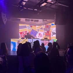Ember Music Hall - The stage was so fun with lots of playbills and colorful lights