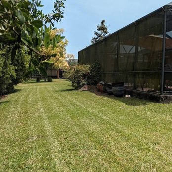 Refresh Lawn Care - a view of the back of a house - Lawn Services Near Me - Wimauma, Florida