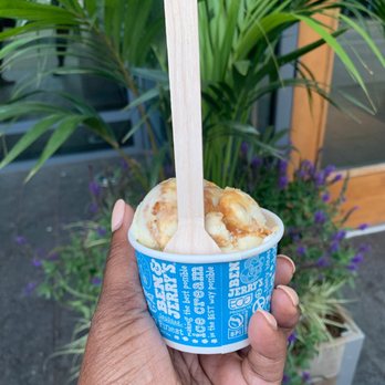 Ben & Jerry's - a hand holding a cup of ice cream - Desserts Near Me - Boston, Massachusetts Ben & Jerry's - a hand holding a cup of ice cream - Desserts Near Me - Boston, Massachusetts