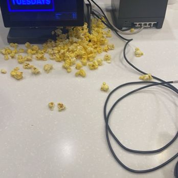 AMC Castleton Square 14 - mess of popcorn directly in front of customers - Cinema Near Me - Indianapolis, Indiana