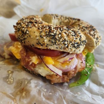 Bruegger's Bagels - Western Sandwich on an Everything Bagel. Toppings include bacon, egg, cheese, red and green peppers, onion, and that amazing sauce. - Sandwiches Near Me - Boston, Massachusetts