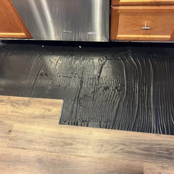 Elite Flooring Repair - Water on top of the barrier paper underneath the LVP. - Flooring Near Me Elite Flooring Repair - Water on top of the barrier paper underneath the LVP. - Flooring Near Me