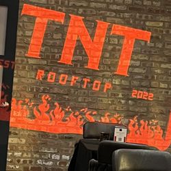 TNT Rooftop Restaurant - Logo