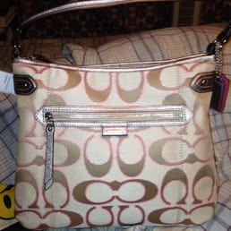 One of my favorite Coach purses! The pink accents around the C logo are gorgeous!