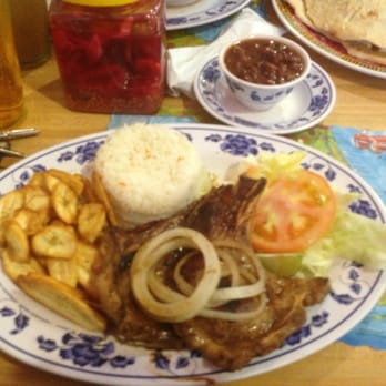 Jennifer's Cafeteria - Pork chops with rice beans, and fried green banana. - Latin American Near Me - North Miami Beach, Florida Jennifer's Cafeteria - Pork chops with rice beans, and fried green banana. - Latin American Near Me - North Miami Beach, Florida