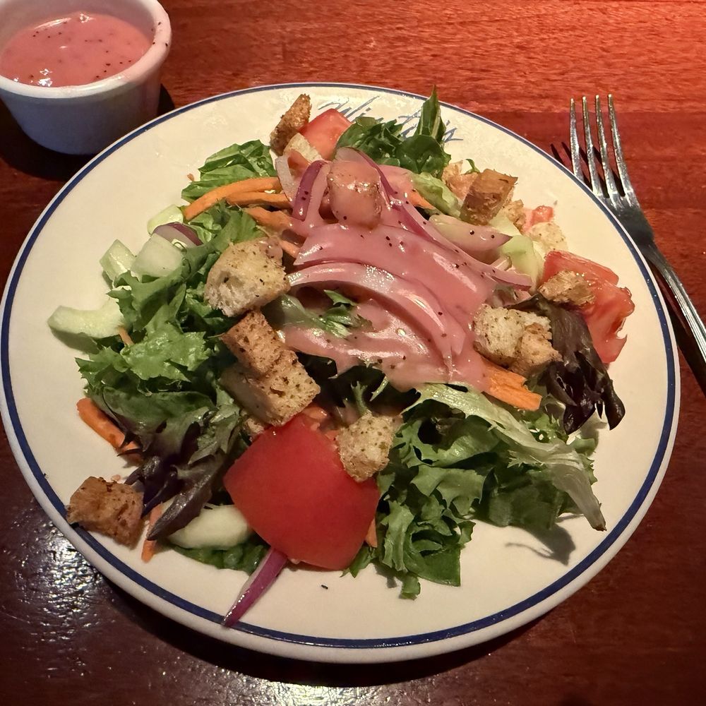 Winston's Grille - House side salad with raspberry vinnaigrette salad dressing. - American Near Me - Raleigh, North Carolina Winston's Grille - House side salad with raspberry vinnaigrette salad dressing. - American Near Me - Raleigh, North Carolina