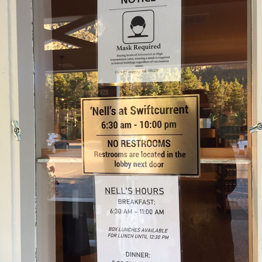 Nell's - a sign on the door of a restaurant - American Near Me - Babb, Montana Nell's - a sign on the door of a restaurant - American Near Me - Babb, Montana