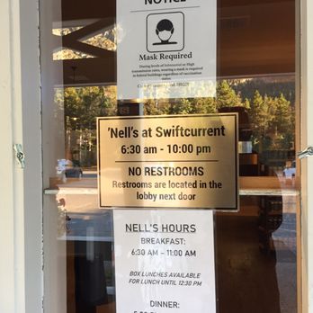 Nell's - a sign on the door of a restaurant - American Near Me - Babb, Montana Nell's - a sign on the door of a restaurant - American Near Me - Babb, Montana