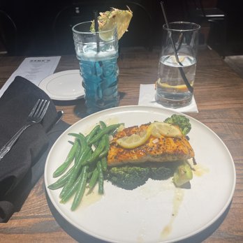 Zeke's Kitchen & Bar - Pan Seared Salmon, broccoli, and green beans. - New American Near Me - Smyrna, Georgia