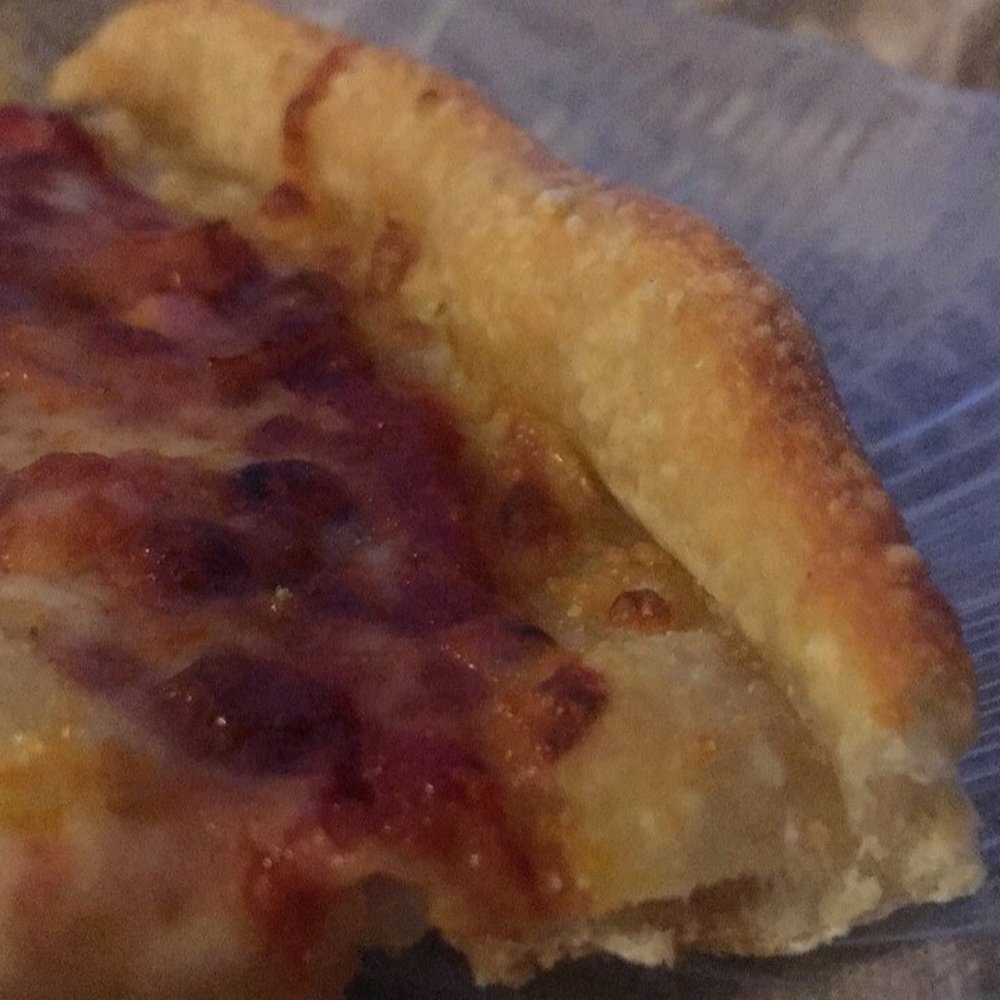 Tweedo's Pizza - a slice of pizza on a plate - Ice Cream & Frozen Yogurt Near Me - Ashburnham, Massachusetts