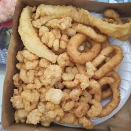 Their Choose 2 combo meal..... whiting with popcorn shrimp, hushpuppies, and the fries are under the pile of food.